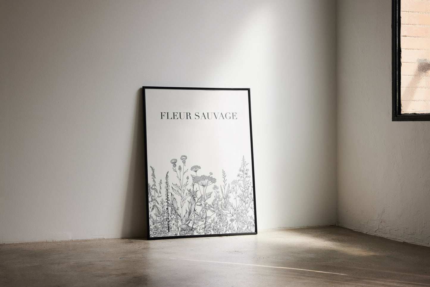 Framed artwork titled 'Fleur Sauvage' on a wall in a room with natural light.